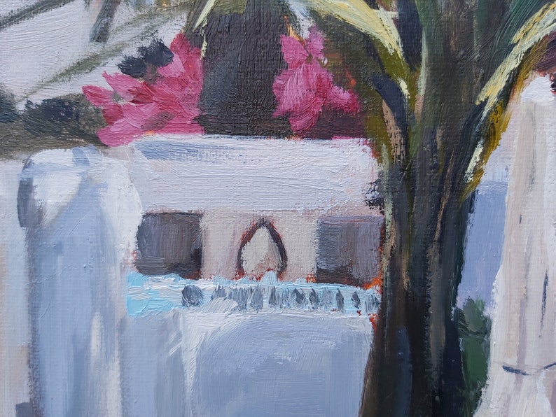 May include: A close-up of a painting depicting a white vase with pink flowers and green leaves. The vase is partially obscured by a dark green plant.