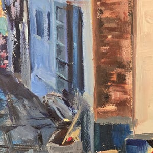 May include: An impressionistic oil painting of a European street scene. The artwork features a blue building with a red arrow sign, a brick wall, and various objects, including wooden barrels and a sign with the artist's signature.