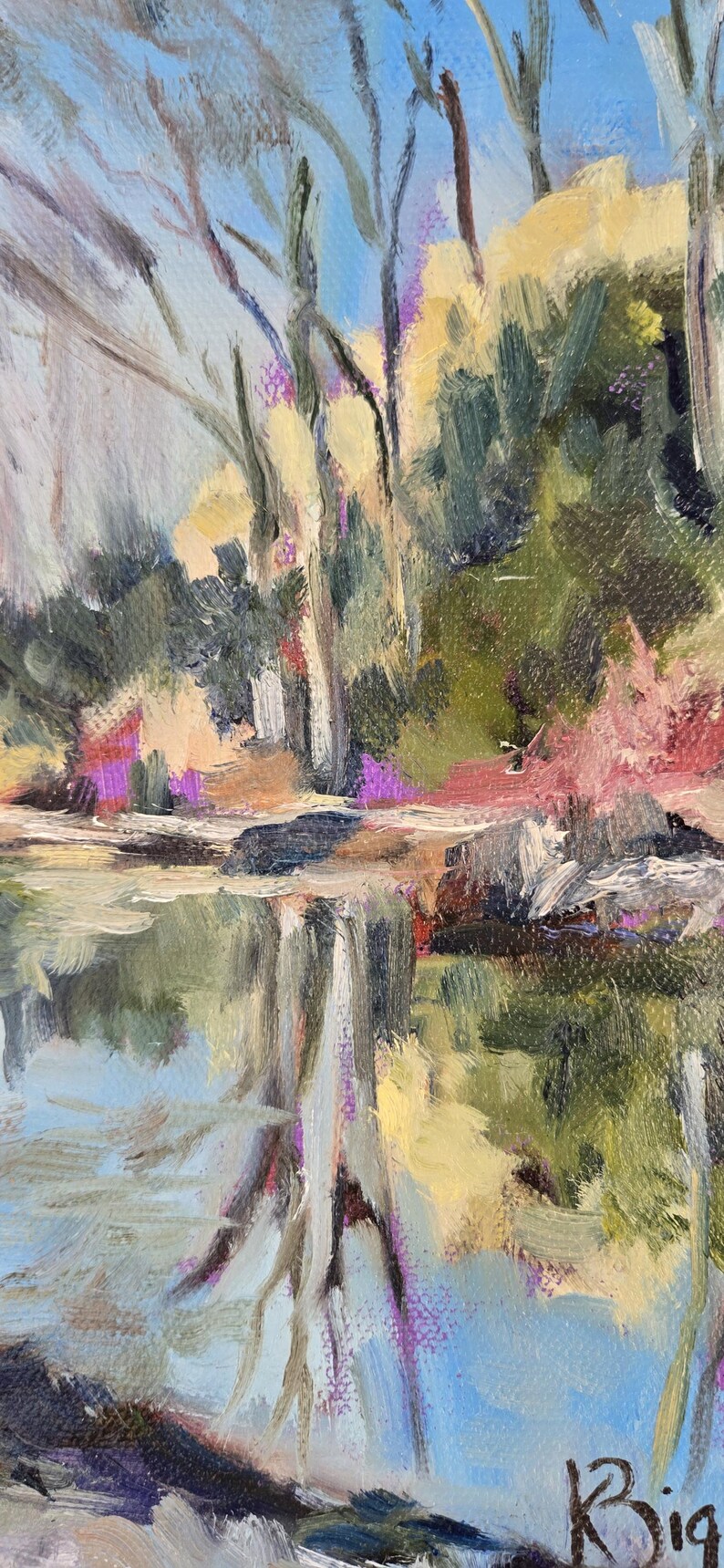 May include: A painting of a landscape with trees reflected in a still body of water. The trees are a mix of green, brown, and yellow, and the water is a light blue. The painting is signed "Big" in the lower right corner.