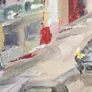 May include: Abstract oil painting depicting a cityscape with buildings and streets. The artwork uses a palette of neutral tones with accents of red, yellow, and green. The brushstrokes are visible, creating a textured effect.
