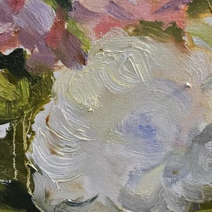 May include: Close-up of an oil painting depicting a bouquet of flowers. The artwork features thick brushstrokes and a palette of white, pink, yellow, and green hues. The flowers are the focal point, with detailed textures and vibrant colors.