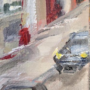 May include: An impressionistic oil painting of a city street scene. The artwork features a palette of muted tones with accents of red and yellow. The brushstrokes are visible, creating a textured effect.
