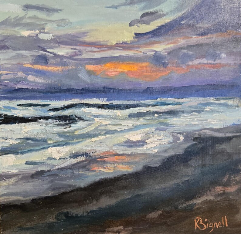May include: Square oil painting of a seascape at sunset. The sky is filled with shades of blue, purple, and orange, with dark clouds. The ocean waves are white and foamy, and the beach is dark gray. Signed "Bignell" in the bottom right corner.