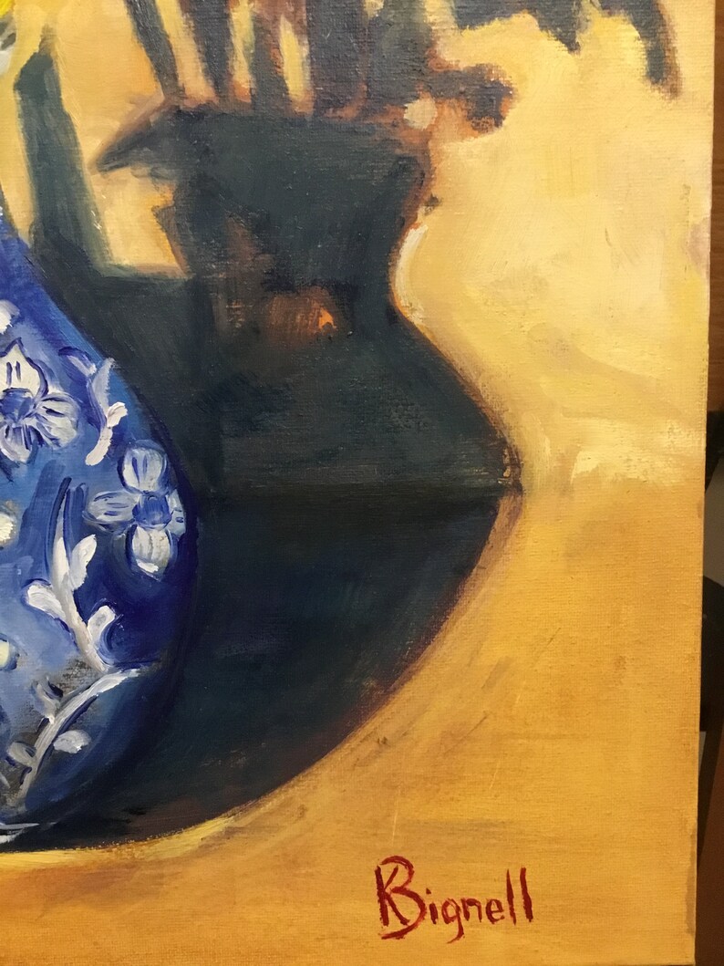 May include: A blue and white ceramic vase with floral designs sits on a yellow surface. The vase is partially obscured by a dark shadow. The artist's signature, "Bignell", is written in red in the lower right corner.