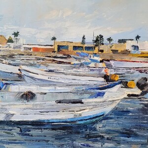 This is a painting of boats in the Essaouira port in Morocco.  Palette knife was used to recreate the feeling of layers of paint chipped away with time.