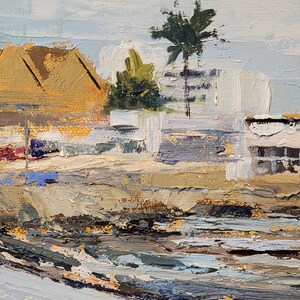 May include: Impasto oil painting of a coastal scene with boats and buildings. The artwork features a palette of blues, tans, and greens, with a palm tree and a light blue sky. The brushstrokes are thick and textured.