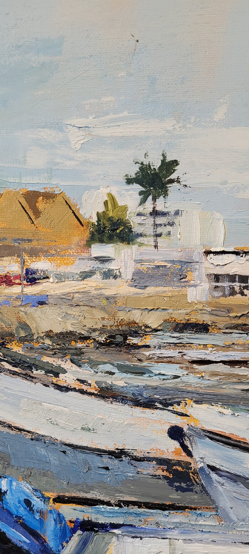 May include: Impasto oil painting of a coastal scene with boats and buildings. The artwork features a palette of blues, tans, and greens, with a palm tree and a light blue sky. The brushstrokes are thick and textured.