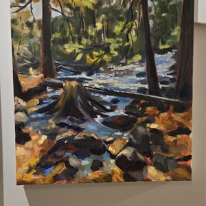 May include: Oil painting of a forest scene with a stream. The artwork features tall trees, a flowing stream, and a tree stump in the foreground. The color palette includes greens, browns, and blues, creating a naturalistic landscape.