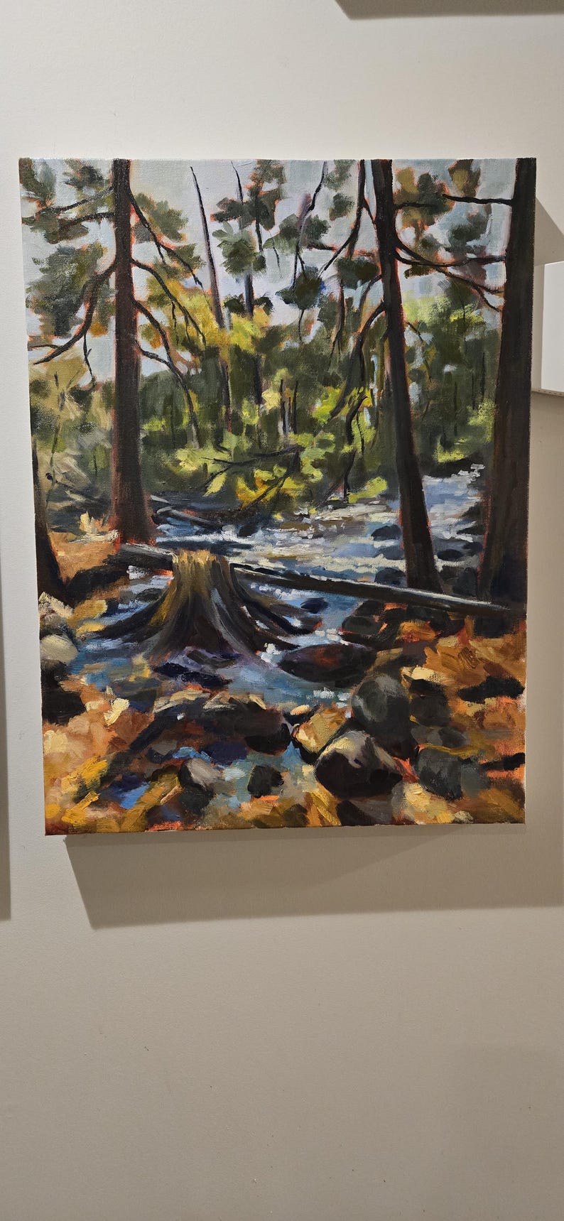 May include: Oil painting of a forest scene with a stream. The artwork features tall trees, a flowing stream, and a tree stump in the foreground. The color palette includes greens, browns, and blues, creating a naturalistic landscape.