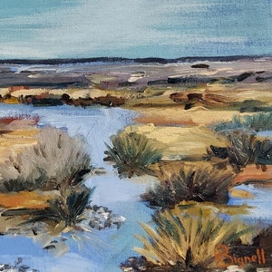 May include: A painting of a marsh landscape with a blue sky and a small stream of water flowing through the center. The stream is surrounded by green and brown grasses and reeds. The painting is done in a loose, impressionistic style.