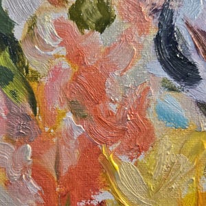 May include: Close-up of an abstract oil painting featuring a vibrant floral arrangement. The artwork showcases textured brushstrokes in shades of orange, yellow, pink, green, and white, creating a dynamic and colorful composition. The painting evokes a sense of warmth and natural beauty.
