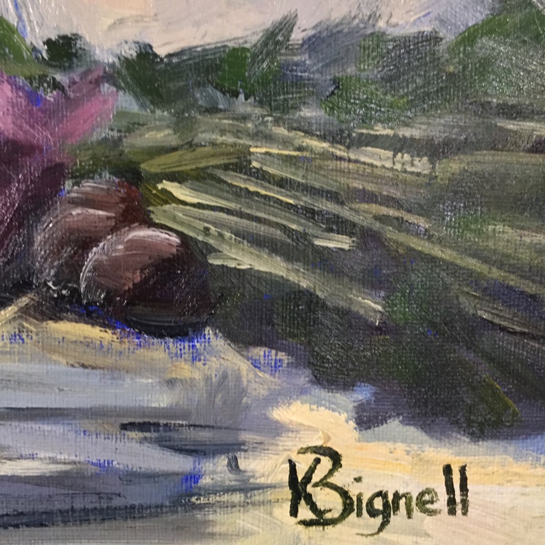 May include: An oil painting depicting a still life with dark purple olives, green leaves, and pink flowers. The artist's signature, "Bignell," is visible in black script at the bottom right corner. The painting has a textured, impressionistic style.