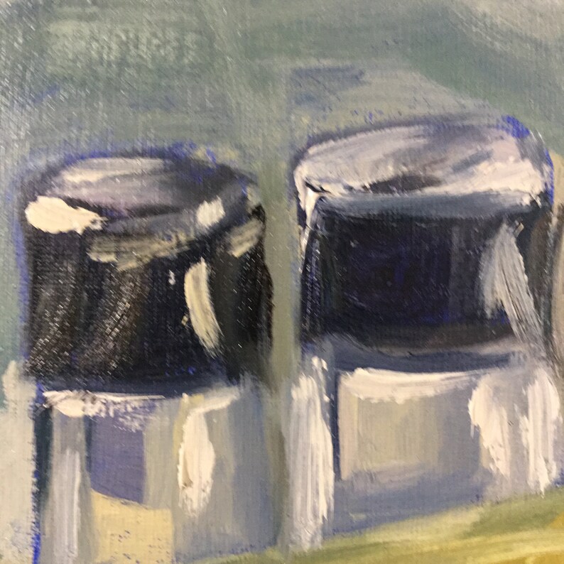 May include: An abstract oil painting featuring two dark blue cylindrical shapes with white highlights. The background is a blend of light blue and green, with yellow and gray tones at the bottom. The artwork has a textured, brushstroke appearance.