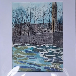 May include: Watercolor landscape art print featuring a winter scene with bare trees, a stone wall, and a body of water. The artwork is matted in white and signed in the lower right corner. The color palette includes blues, greens, and grays.