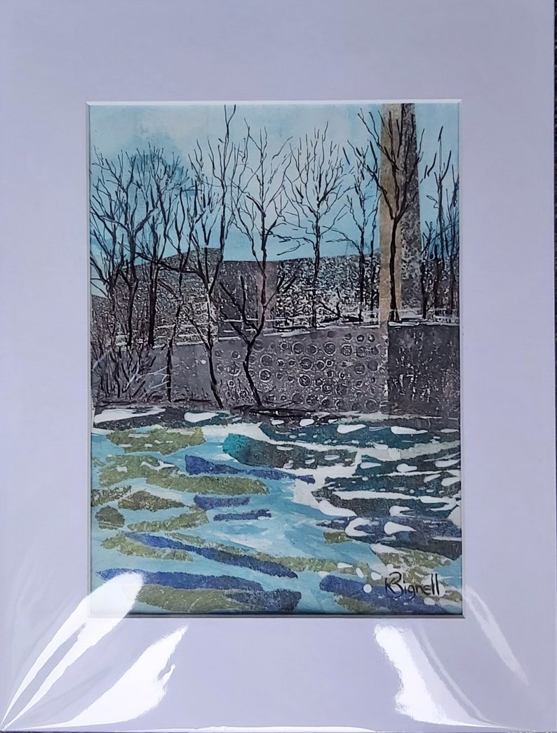 May include: Watercolor landscape art print featuring a winter scene with bare trees, a stone wall, and a body of water. The artwork is matted in white and signed in the lower right corner. The color palette includes blues, greens, and grays.