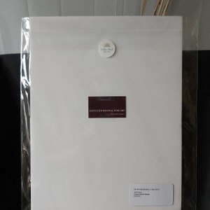May include: A white sheet of paper with a business card for Kathleen Bignell Fine Art. The card is burgundy with white text. The text on the card reads "Kathleen Bignell Fine Art" and "kathleenbignell.com". There is a small white circle sticker with a logo and the text "Kathleen Bignell Fine Art" on the top of the sheet of paper.