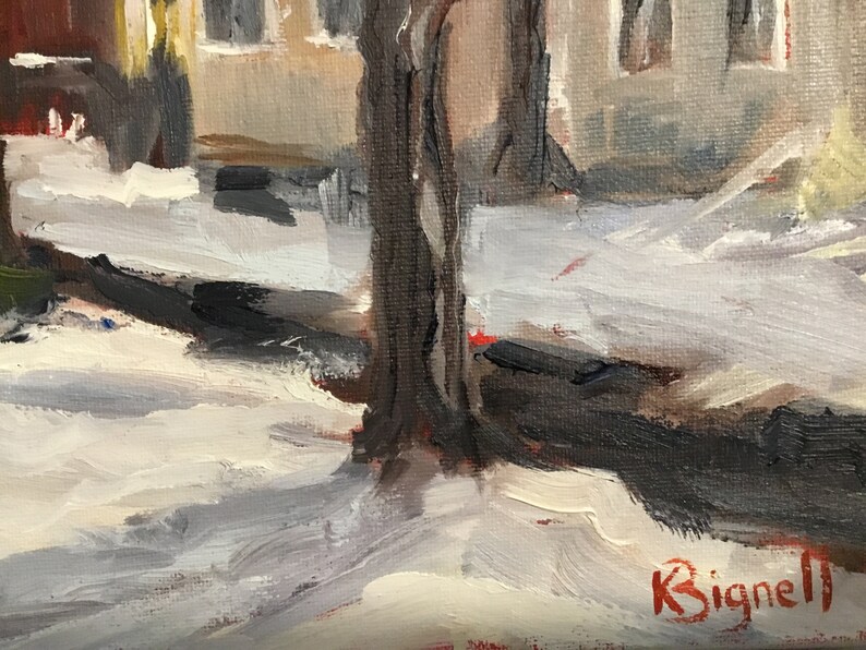 May include: A close-up of a painting depicting a snowy street scene with a tree trunk in the foreground. The artist's signature, "K. Signell", is visible in the lower right corner.