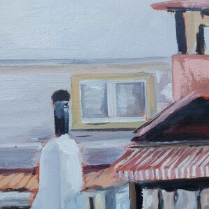May include: A painting of a building with a striped awning, a chimney, and a window with a yellow frame. The building is painted in shades of pink, brown, and white.