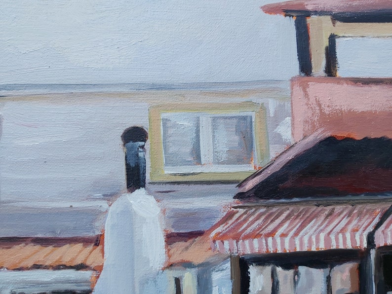 May include: A painting of a building with a striped awning, a chimney, and a window with a yellow frame. The building is painted in shades of pink, brown, and white.