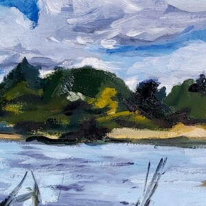 May include: Impressionistic oil painting of a serene landscape. The artwork depicts a body of water with a sandy shore, lush green trees, and a cloudy sky. The brushstrokes create a textured effect, capturing the natural light and atmosphere.