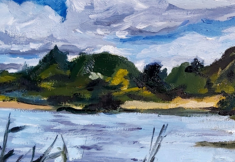 May include: Impressionistic oil painting of a serene landscape. The artwork depicts a body of water with a sandy shore, lush green trees, and a cloudy sky. The brushstrokes create a textured effect, capturing the natural light and atmosphere.