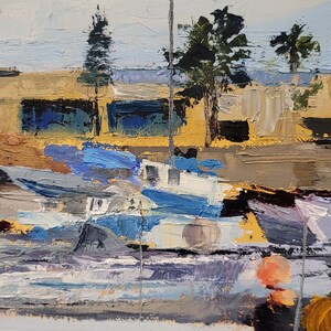 May include: Impressionistic oil painting of a harbor scene. The artwork depicts boats in shades of blue and white, with a backdrop of buildings and trees under a light blue sky. The brushstrokes are thick and textured, creating a sense of depth and movement.