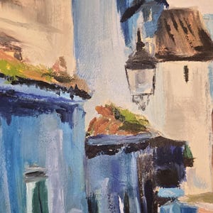 May include: An abstract painting of a European street scene. Buildings are painted in shades of blue, white, and tan, with a street and a person in the foreground. A street lamp hangs from a building.