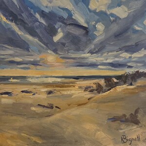 May include: An oil painting on canvas depicting a coastal landscape with a sandy beach, a dark horizon line, and a dramatic sky filled with thick, textured clouds in shades of blue, gray, and white. The artist signature Bignell is in the corner.