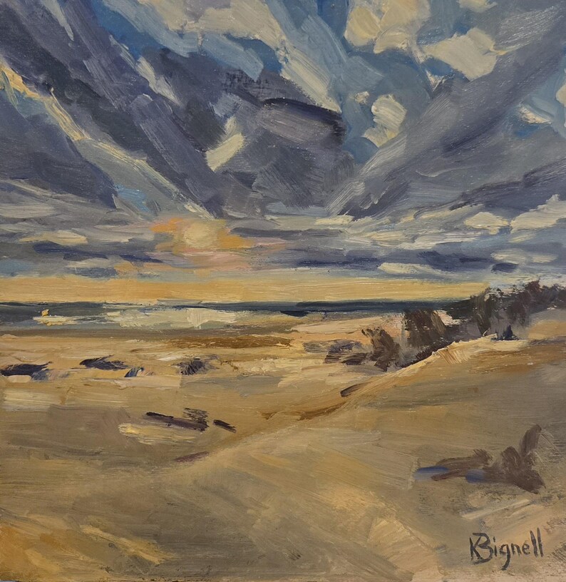 May include: An oil painting on canvas depicting a coastal landscape with a sandy beach, a dark horizon line, and a dramatic sky filled with thick, textured clouds in shades of blue, gray, and white. The artist signature Bignell is in the corner.