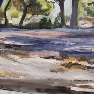 May include: An impressionistic oil painting of a sunlit forest scene. The foreground features a path with long shadows cast by trees. The trees have dark trunks and green foliage, with sunlight filtering through the leaves.