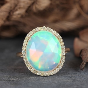 Ethiopian Opal Cocktail Ring: 14k Yellow Gold Pave Diamond Halo