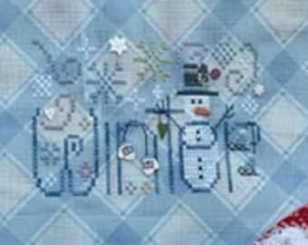 May include: A blue and white gingham fabric zippered pouch with a cross-stitch design featuring a snowman and the words "Oh Winter". The pouch is surrounded by snowballs, a blue and white knitted scarf, and a red and white knitted scarf.