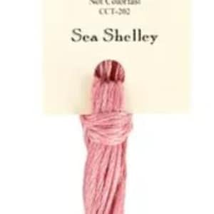May include: A skein of pink embroidery floss labeled "Classic Colorworks Sea Shelley" with the details "5 yards, 100% Cotton, Not Colorfast, CTF-382".