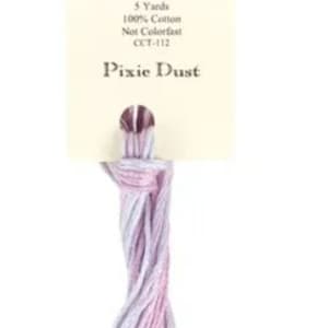 May include: A skein of Classic Colorworks embroidery floss in the color "Pixie Dust". The floss is a gradient of light purple and pink. The label reads "Classic Colorworks", "5 Yards", "100% Cotton", "Not Colorfast", "OCT-112", and "Pixie Dust".