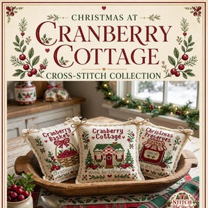 May include: Three square cross-stitch pillows in a wooden bowl. The left pillow reads Cranberry Basket, the center reads Cranberry Cottage Home for Christmas, and the right reads Christmas Preserves Made With Love, all featuring festive red and green motifs.