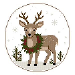 May include: A circular cross-stitch pattern featuring a light brown deer with dark brown antlers, wearing a green wreath with red berries around its neck. The scene includes small green pine trees, white snowflakes, and a light gray snowy ground.
