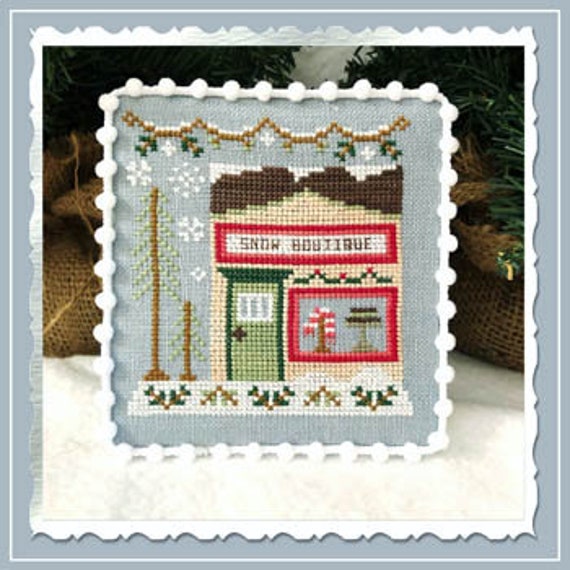 Country Cottage Needleworks SNOW VILLAGE 7  – Snow Boutique Cross Stitch Pattern