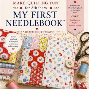 May include: A square fabric needlebook featuring a patchwork design of red, white, blue, and yellow floral and strawberry patterns. It includes a cream-colored button closure, a pink elastic band, and the text 'MY FIRST NEEDLEBOOK' on the cover.