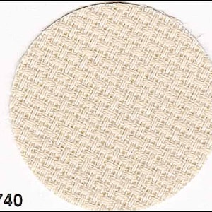 May include: A close-up of a cream-colored woven fabric with a subtle diamond pattern. The fabric is smooth and has a soft texture.