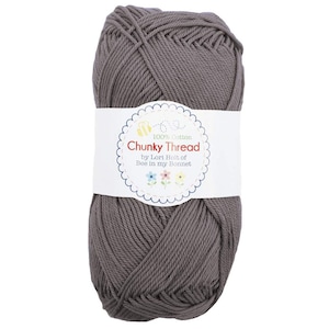 May include: A skein of gray 100% cotton yarn labeled "Chunky Thread by Lori Holt of Bee in my Bonnet"