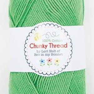 May include: A ball of green 100% cotton yarn labeled "Chunky Thread" by Lori Holt of Bee in my Bonnet.