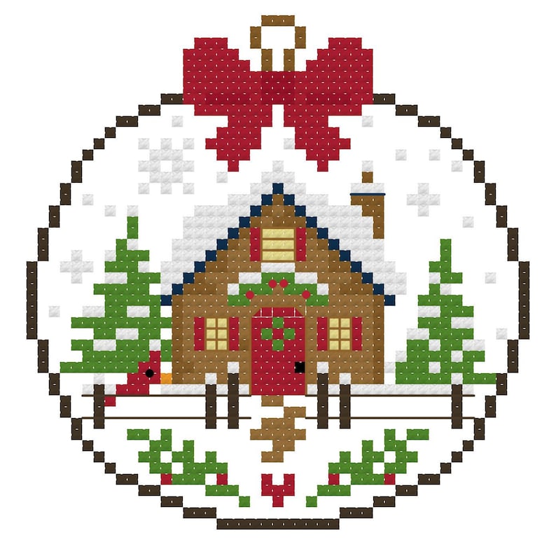 May include: A cross-stitch pattern of a round ornament featuring a brown cabin with a red door, snow-covered roof, and chimney. The scene includes two green pine trees, a red bird, a fence, and a large red bow at the top, all on a white background.