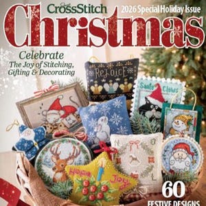 May include: A magazine cover titled Just CrossStitch 2026 Special Holiday Issue Christmas featuring 60 festive designs. The image displays various cross-stitch ornaments including a reindeer, a snowman, a rabbit, and a star in a basket.