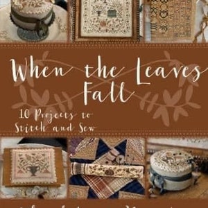 May include: A book cover with the title "When the Leaves Fall" and the subtitle "10 Projects to Stitch and Sew". The cover features a brown background with a floral design and images of various needlepoint projects, including a small house, a vase of flowers, and a birdhouse.