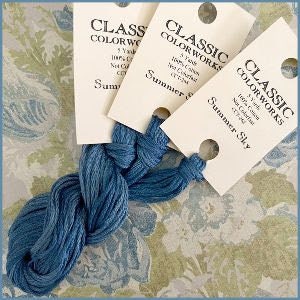 May include: Three skeins of Classic Colorworks embroidery floss in the color Summer Sky. The floss is a medium blue color. Each skein is 2 yards long and is 100% cotton.