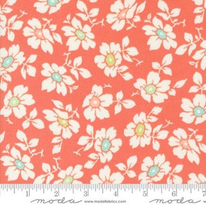 May include: Coral pink fabric with a white floral pattern. The flowers have a light green center and a light blue accent.