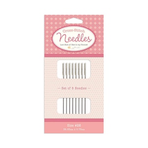 May include: A package of cross-stitch needles, size #26, with the text "Cross-Stitch Needles" and "Lori Holt of Bee in my Bonnet". The package contains a set of 8 needles, each measuring 1.45 inches in length and 0.03 inches in diameter. The packaging is pink and white.
