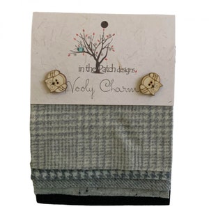 May include: A package of fabric squares with a variety of gray patterns, including houndstooth and plaid. Two wooden owl-shaped buttons are attached to a card with the text "in the Patch designs" and "Wooly Charm."