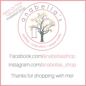 May include: A pink circle with the text "anabella's" in a white font. Inside the circle is a gray tree with a swing. The text "quilting ~ cross stitch ~ paper crafts" is written around the circle. Below the circle is the text "Facebook.com/anabellasshop" and "Instagram.com/anabellas_shop". The text "Thanks for shopping with me!" is at the bottom of the image.