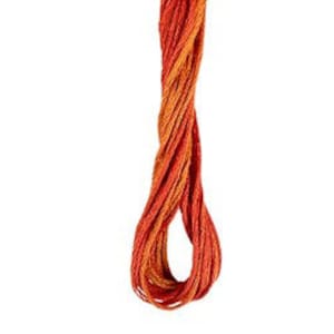 May include: A spool of embroidery floss in shades of orange and red.